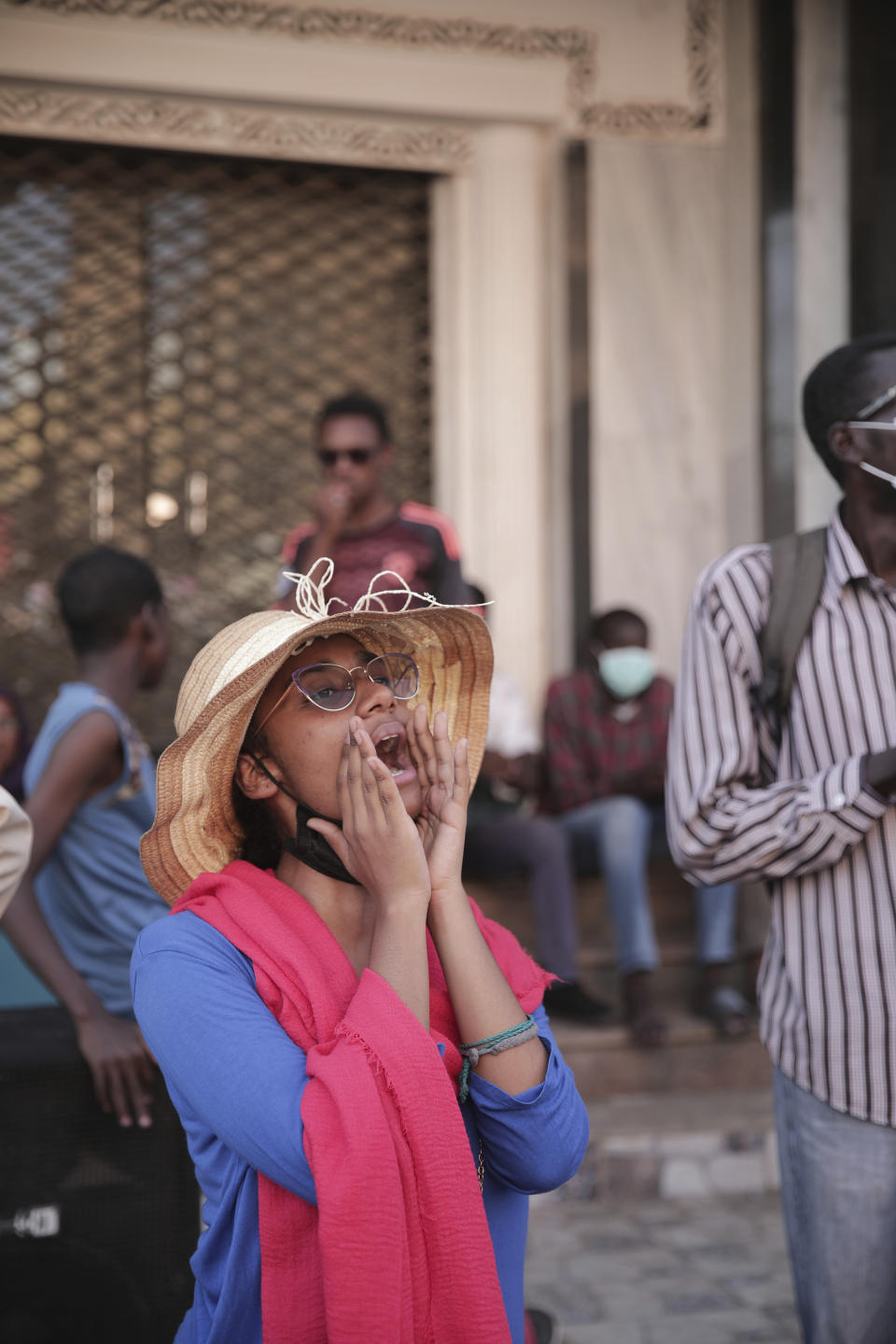 People chant slogans during a protest in Khartoum, amid ongoing demonstrations against a military takeover in Khartoum, Sudan, Thursday, Nov. 4, 2021. (AP Photo/Marwan Ali)