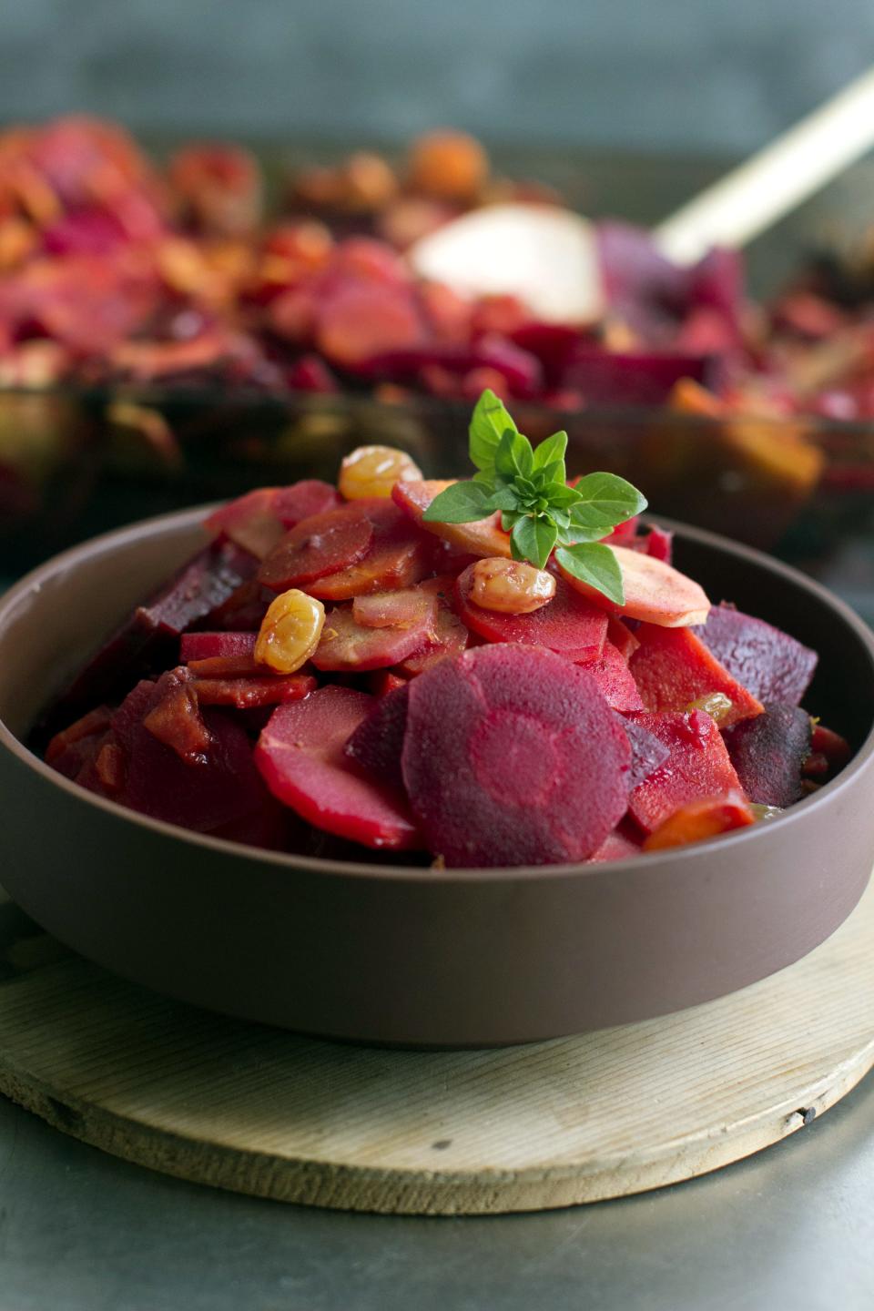 This July 28, 2014 photo shows carrot, parsnip, beet and sweet potato tsimmes, a traditional Ashkenazi Jewish stew, often part of the Rosh Hashanah meal.