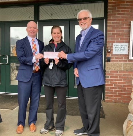 From left to right are Justin Finn, president of the Rotary Club of Portsmouth, Stacey Gosselin, K-8 Health and P.E. Teacher at Greenland Central School, and Steve Wood, treasurer of the Rotary Club of Portsmouth.