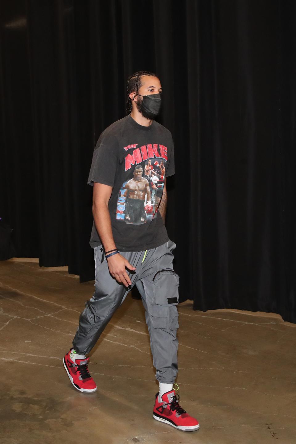 Michael Carter-Williams wearing a T-shirt for a Mike Tyson fight…that never happened.