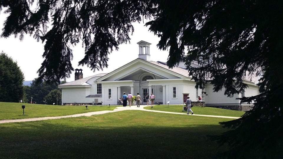 Visitors walk into the Norman Rockwell Museum Friday, July 22, 2005, in Stockbridge, Mass. The museum will present an exhibition, opening on Saturday, May 7, 2022, of works celebrating the 100th anniversary of the Lincoln Memorial. (AP Photo/Chitose Suzuki, File)