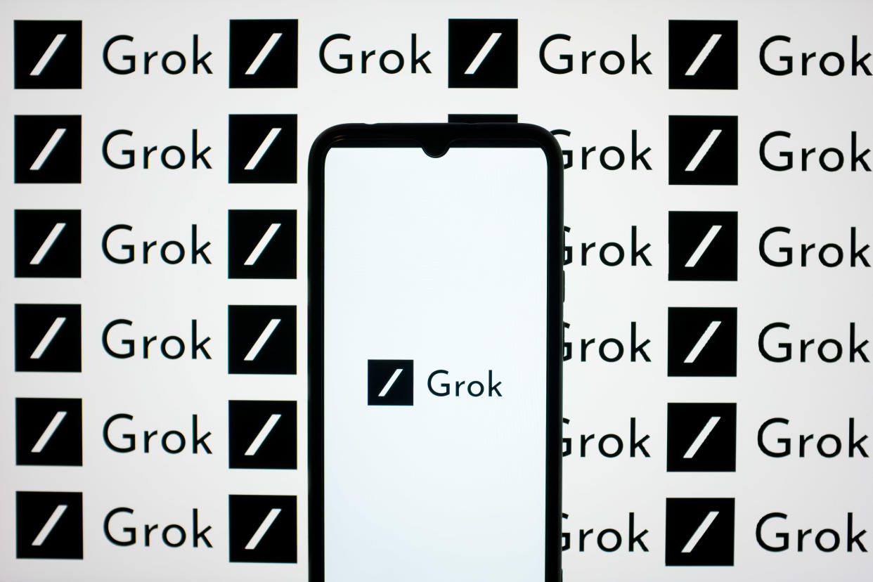 The Grok logos are being displayed on a smartphone screen and on a computer screen in Athens, Greece, on June 7, 2024. (Photo by Nikolas Kokovlis/NurPhoto via Getty Images)