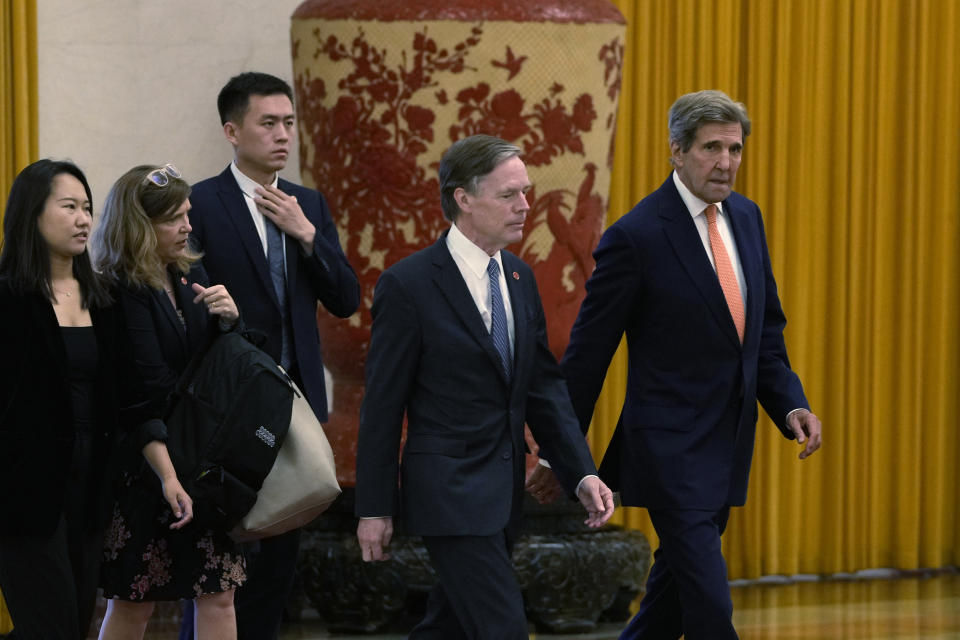 U.S. climate envoy John Kerry, right, walks next to U.S. Ambassador to China Nicholas Burns as they arrive for meetings at the Great Hall of the People in Beijing, Wednesday, July 19, 2023. (AP Photo/Ng Han Guan, Pool)