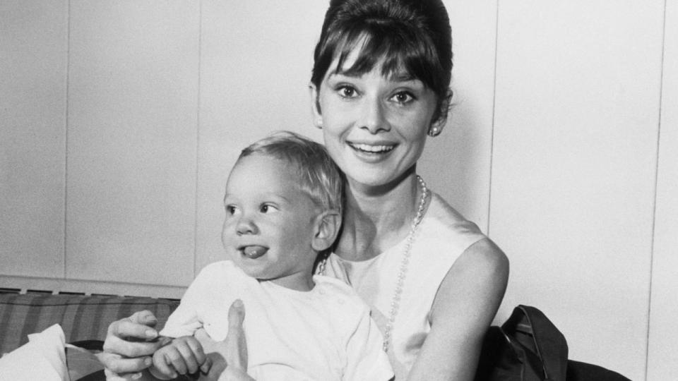 (Original Caption) One of Hollywood’s brightest stars, Audrey Hepburn has a joyful reunion with her son Sean, three years old, upon his arrival from Los Angeles via TWA SuperJet at Idlewild Airport. Miss Hepburn just completed two motion pictures. Breakfast at Tiffany’s and The Children’s Hour.