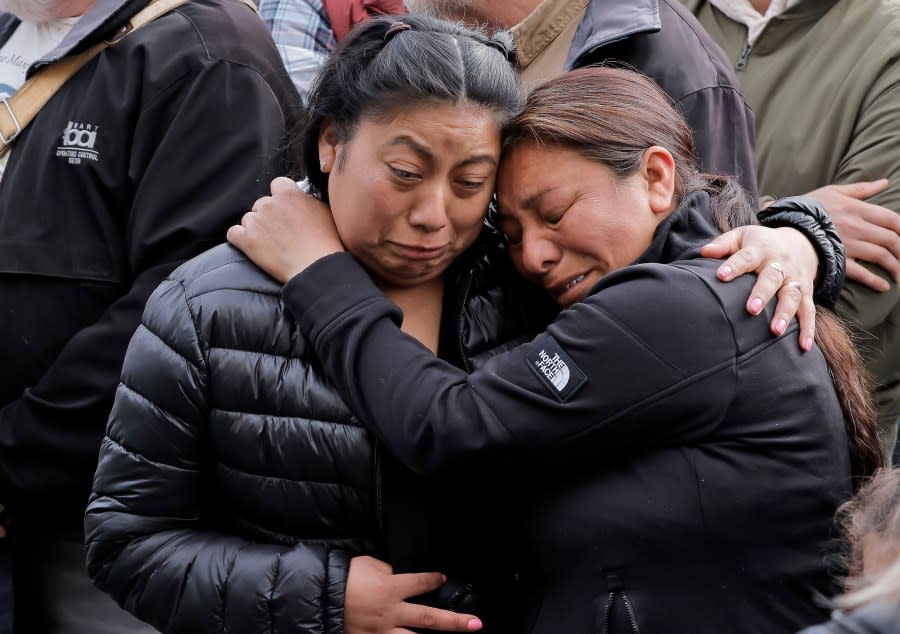 Acquaintances of the victims cry and console each other during a vigil on March 18, 2024. (Carlos Avila Gonzalez/San Francisco Chronicle via AP)