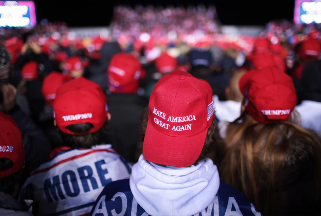 Trump Supporters; MAGA hats Scott Olson/Getty Images