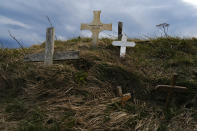Crosses placed by pilgrims of St. James Way are seen in Roncesvalles, northern Spain, Friday, April 9, 2021 photo. The pilgrims are trickling back to Spain's St. James Way after a year of being kept off the trail due to the pandemic. Many have committed to putting their lives on hold for days or weeks to walk to the medieval cathedral in Santiago de Compostela in hopes of healing wounds caused by the coronavirus. (AP Photo/Alvaro Barrientos)