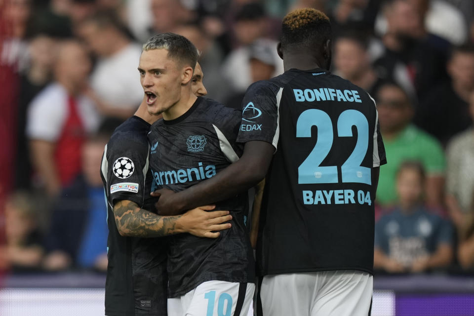 Leverkusen's Florian Wirtz reacts after he scored during the Champions League opening phase soccer match between Feyenoord and Leverkusen in Rotterdam, Netherlands, Thursday, Sept. 19, 2024. (AP Photo/Peter Dejong)