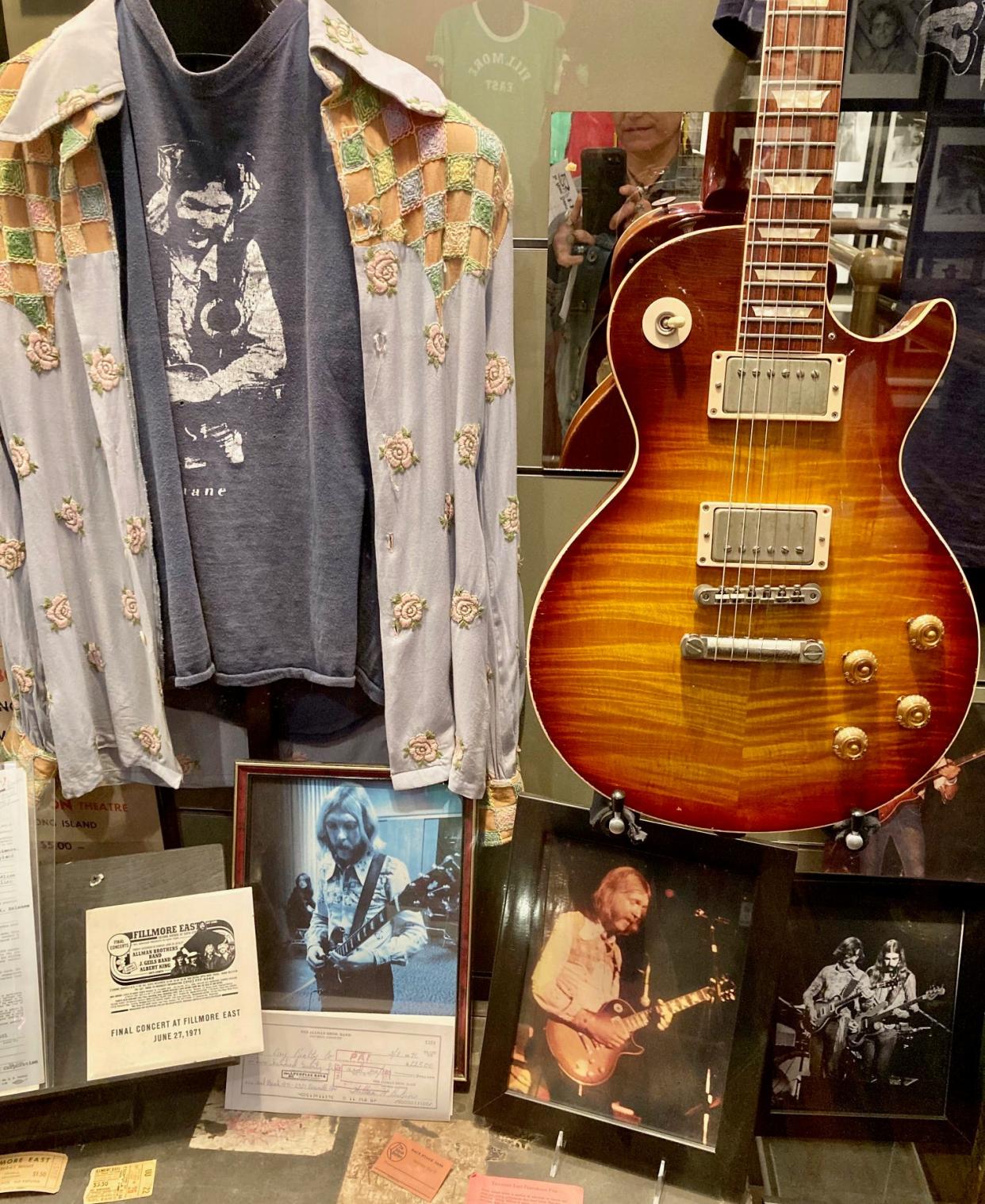 Duane Allman's iconic Western-style shirt alongside his fabled Gibson Les Paul.