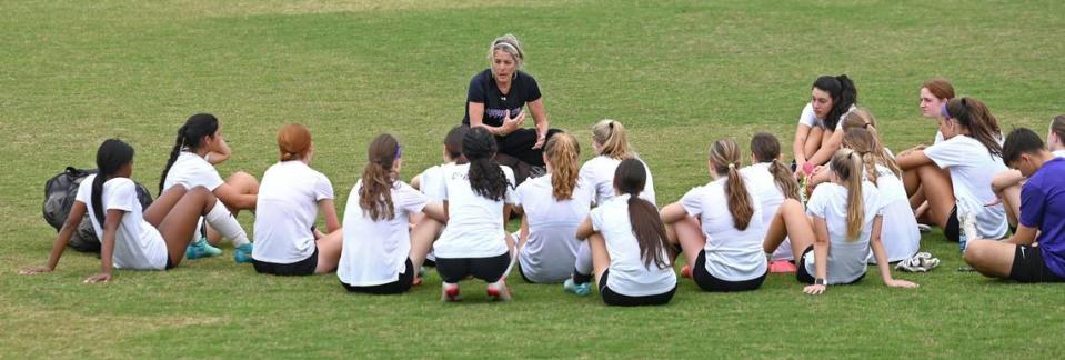 Ardrey Kell girls soccer coach Kim Montgomery speaks to her team following practice on Wednesday, April 17, 2024.