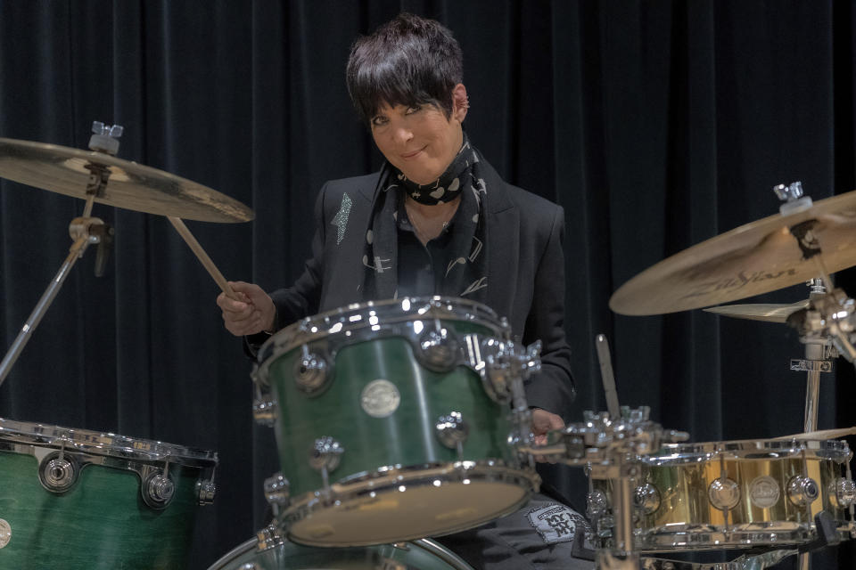 Songwriter Diane Warren plays the drums in her studio at the Realsongs Diane Warren Music Company in Los Angeles, Tuesday, Nov. 15, 2022. Warren will receive an honorary Oscar at the annual Governors Awards. She’s the first songwriter to ever get the award. (AP Photo/Damian Dovarganes)