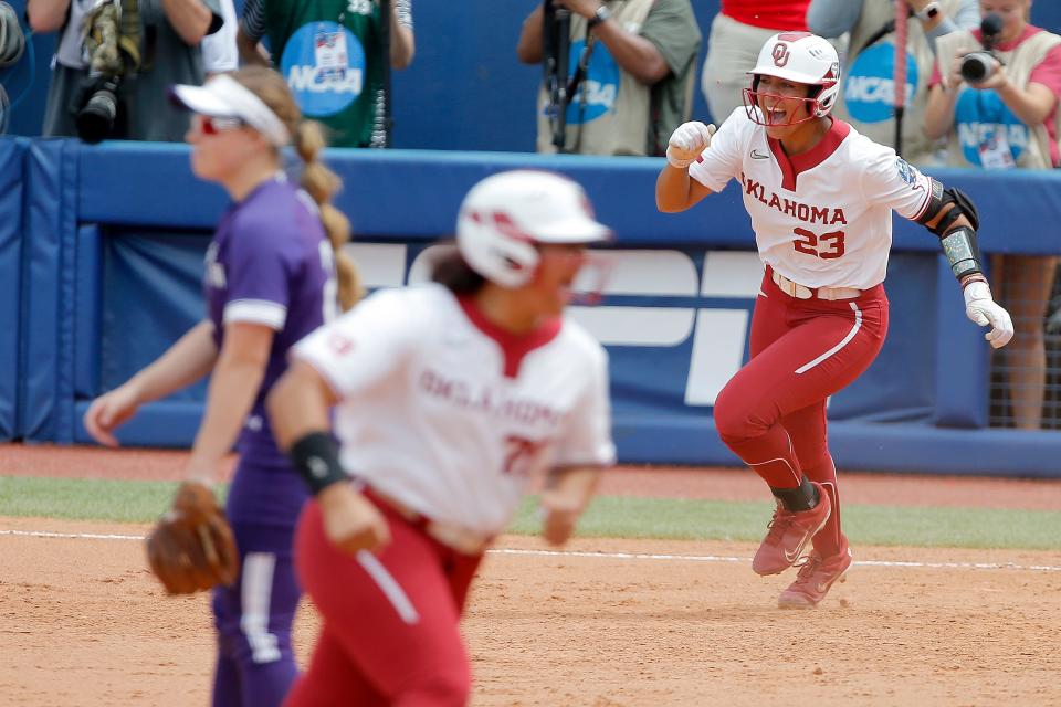 OU's Tiare Jennings (23) celebrates as she hits a grand slam in the third inning of a 13-2 win Thursday against Northwestern on the first day of the Women's College World Series at USA Softball Hall of Fame Stadium in Oklahoma City.