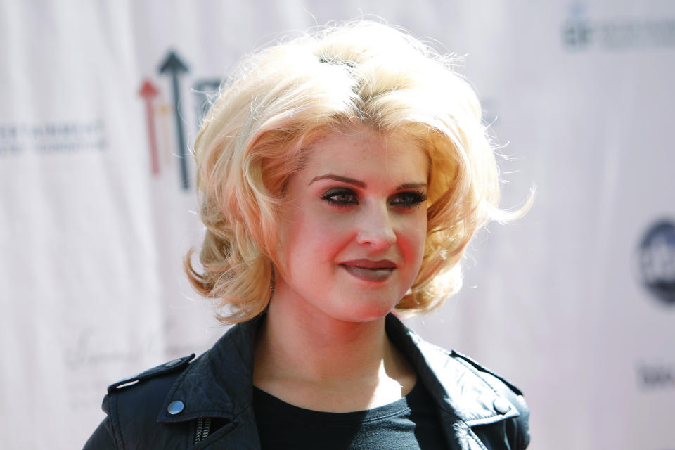 Kelly Osbourne poses at the "Stand Up To Cancer" television event aimed at raising funds to accelerate innovative cancer research at the Sony Studios Lot in Culver City, California, September 10, 2010. The one-hour live commercial-free fundraising event was aired across multiple broadcast and cable channels at the same time. REUTERS/Danny Moloshok (UNITED STATES - Tags: ENTERTAINMENT HEALTH HEADSHOT)