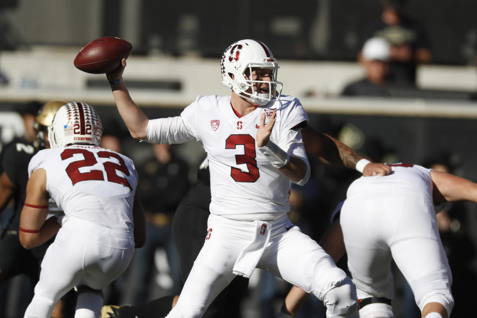 Stanford quarterback K.J. Costello throws a pass in the first half of an NCAA college football game against Colorado, Saturday, Nov. 9, 2019, in Boulder, Colo. (AP Photo/David Zalubowski)