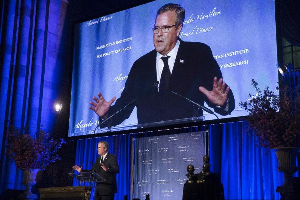 Former Florida Gov. Jeb Bush speaks at the Manhattan Institute for Policy Research Alexander Hamilton Award Dinner, Monday, May 12, 2014, in New York. Bush and Rep. Paul Ryan, R-Wis., courted some of Wall Street’s most powerful political donors Monday night, competing for attention from tuxedoed hedge fund executives gathered in midtown Manhattan as the early jockeying in the 2016 presidential contest quietly continues. (AP Photo/John Minchillo)