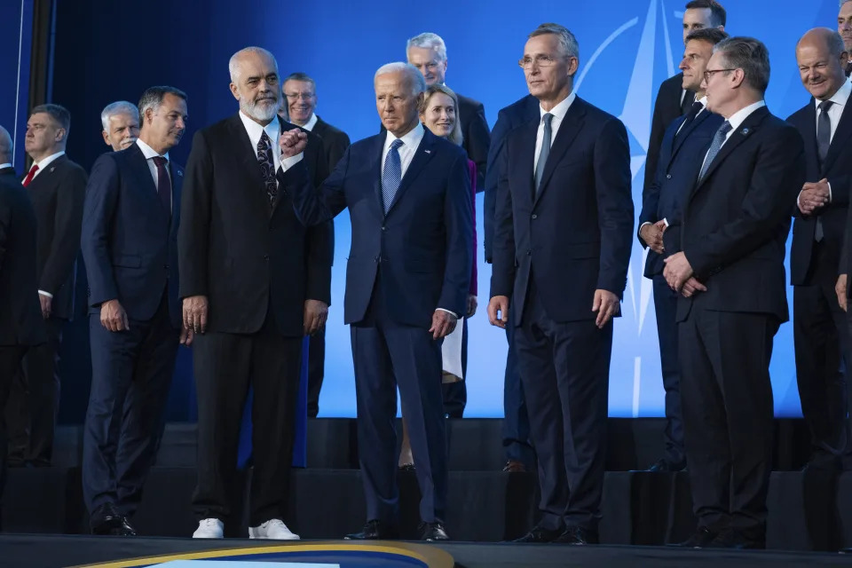 FILE - President Joe Biden pumps his fist during a family photo at the NATO Summit, Wednesday, July 10, 2024, in Washington. Biden’s withdrawal from the U.S. presidential race on Sunday, July 21, injects greater uncertainty into the world at a time Western leaders are grappling with two complicated wars in Ukraine and Gaza, a more assertive China in Asia and the rise of the far-right in Europe that threatens to erode democratic norms. (AP Photo/Evan Vucci, File)