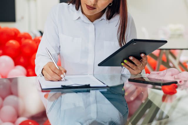 <p>Kosamtu/Getty</p> An event planner working (stock image)