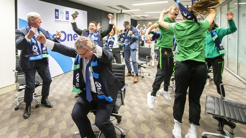 Australian officials and players, pictured here reacting after the World Cup announcement.