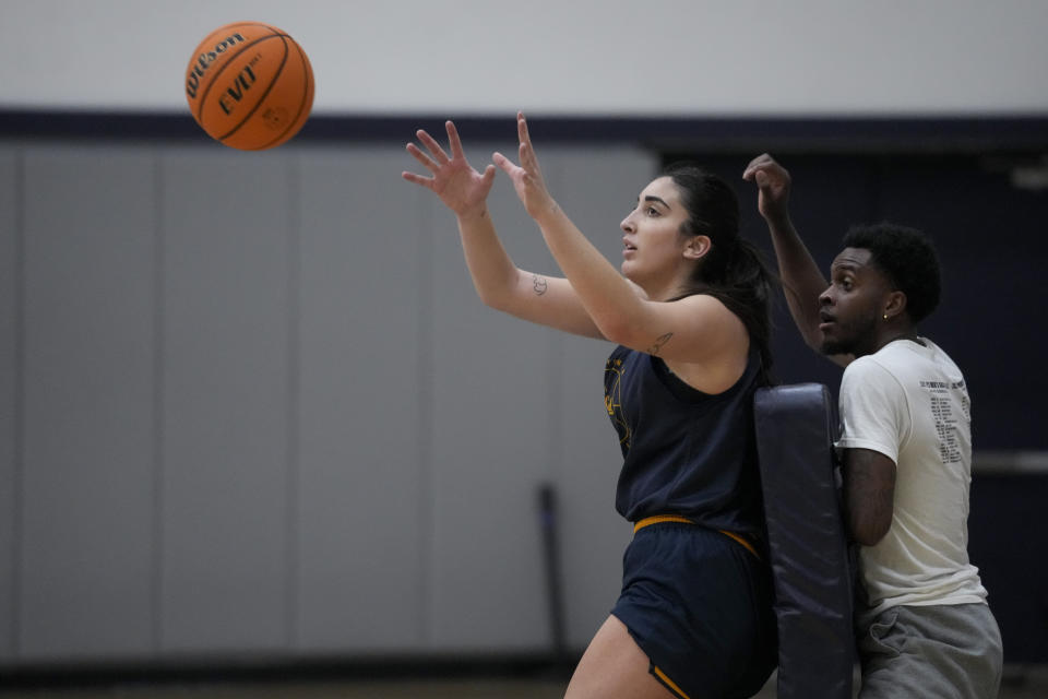 California forward Claudia Langarita, left, takes part in a drill during practice Monday, Dec. 4, 2023, in Berkeley, Calif. (AP Photo/Godofredo A. Vásquez)