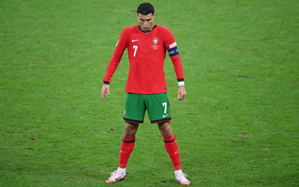 Cristiano Ronaldo of Portugal prepares to take a free kick during the UEFA EURO 2024 round of 16 match between Portugal and Slovenia at Frankfurt Arena on July 01, 2024 in Frankfurt am Main, Germany