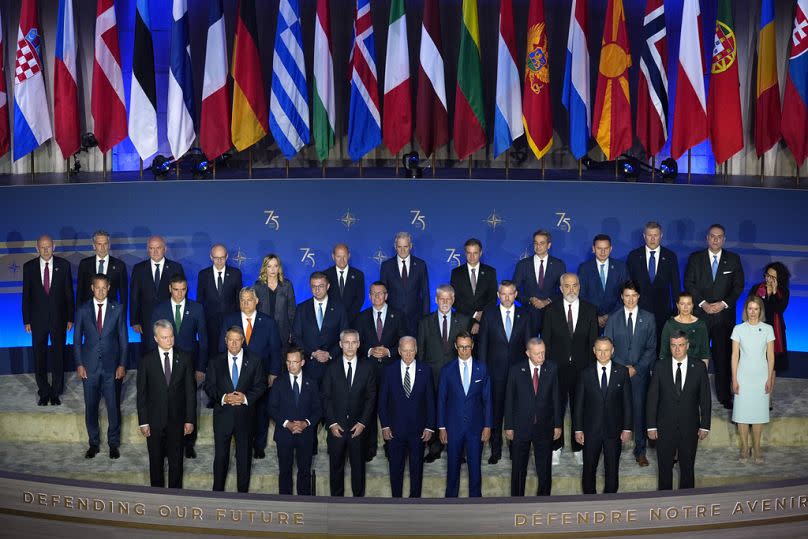 NATO leaders pose for a family photo before President Joe Biden, front row center, delivers remarks on the 75th anniversary of NATO at the Andrew W. Mellon Auditorium, Tuesday