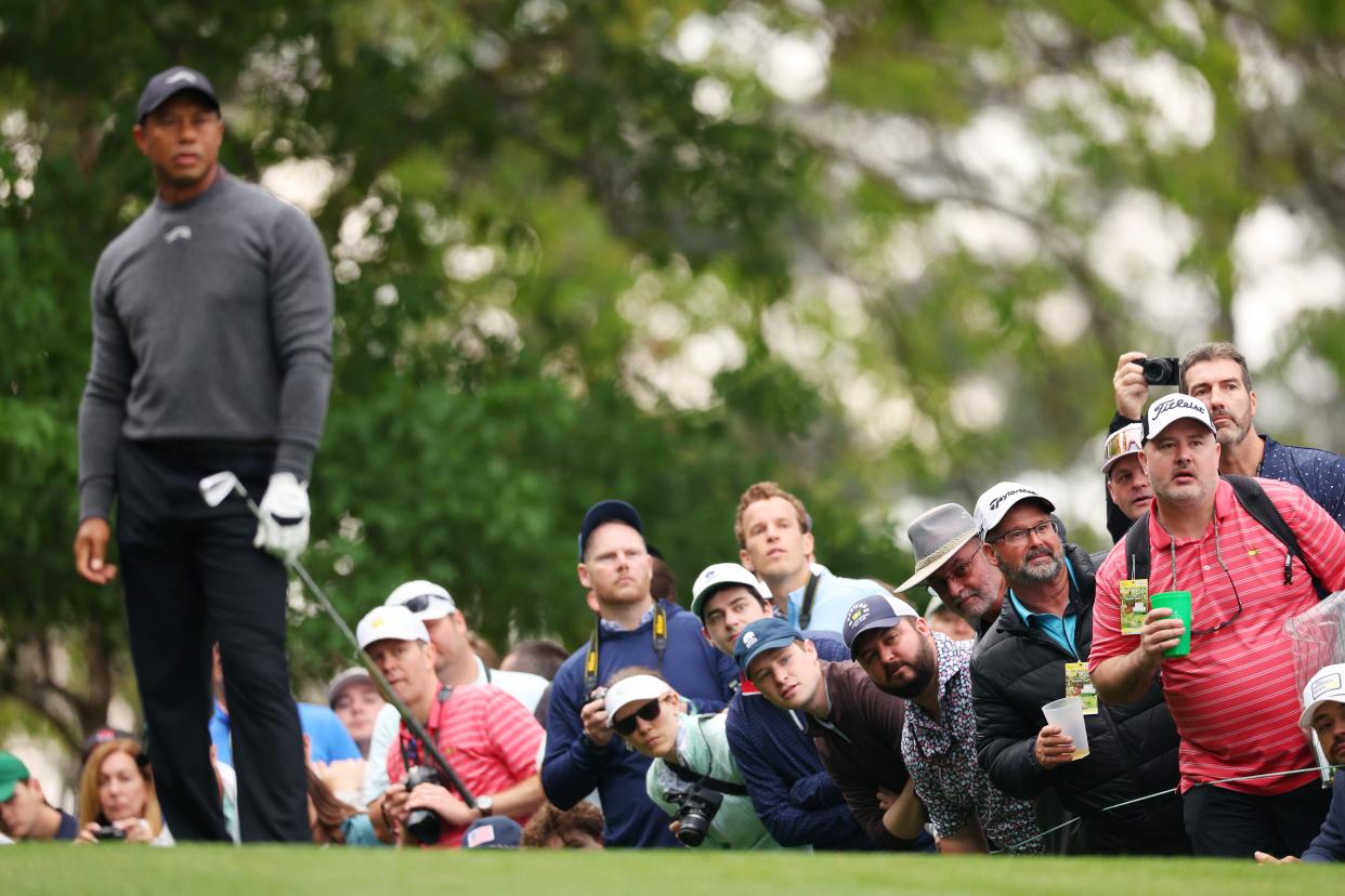 AUGUSTA, GEORGIA - APRIL 09: Patrons watch a shot played by Tiger Woods of the United States during a practice round prior to the 2024 Masters Tournament at Augusta National Golf Club on April 09, 2024 in Augusta, Georgia. (Photo by Andrew Redington/Getty Images)