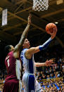 DURHAM, NC - JANUARY 21: Austin Rivers #0 of the Duke Blue Devils drives to the basket as Xavier Gibson #1 of the Florida State Seminoles defends during play at Cameron Indoor Stadium on January 21, 2012 in Durham, North Carolina. (Photo by Grant Halverson/Getty Images)