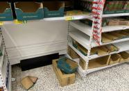 Empty shelves are seen at a supermarket