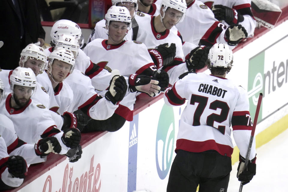 Ottawa Senators' Thomas Chabot (72) returns to the bench after scoring during the first period of an NHL hockey game against the Pittsburgh Penguins in Pittsburgh, Monday, March 20, 2023. (AP Photo/Gene J. Puskar)