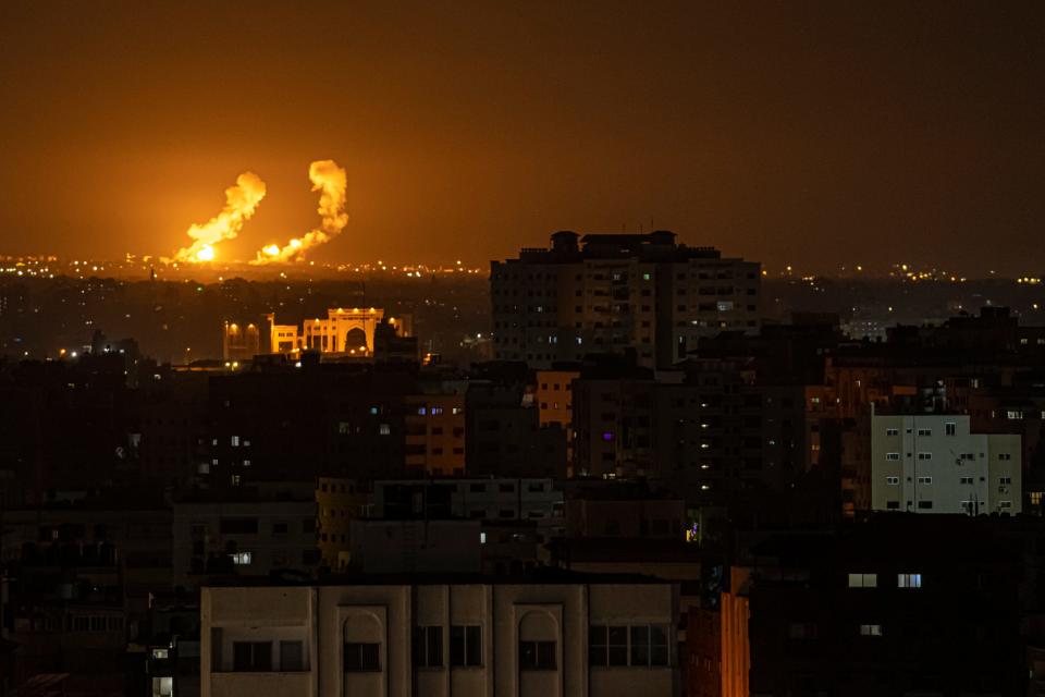 Fire and smoke rise following an Israeli airstrike in southern Gaza Strip, Friday, April 7, 2023.