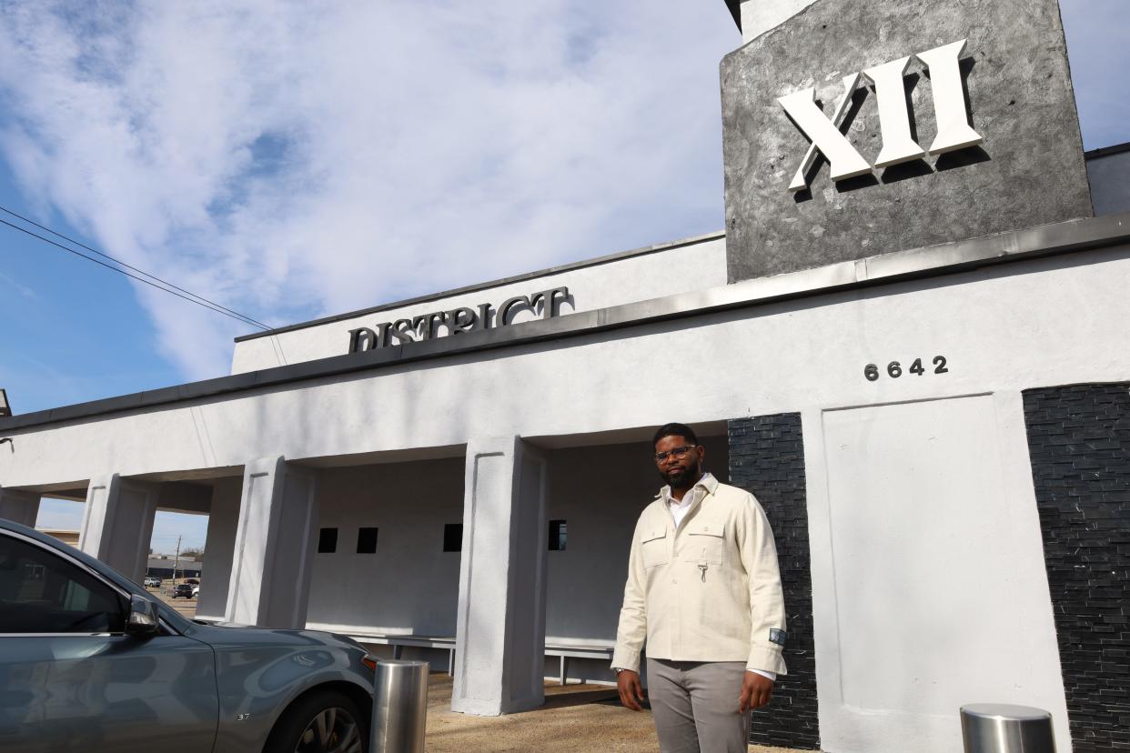 Brent Hooks, co-owner of District XII Social Club, stands outside the new nightclub at 6642 Winchester Road in Memphis.