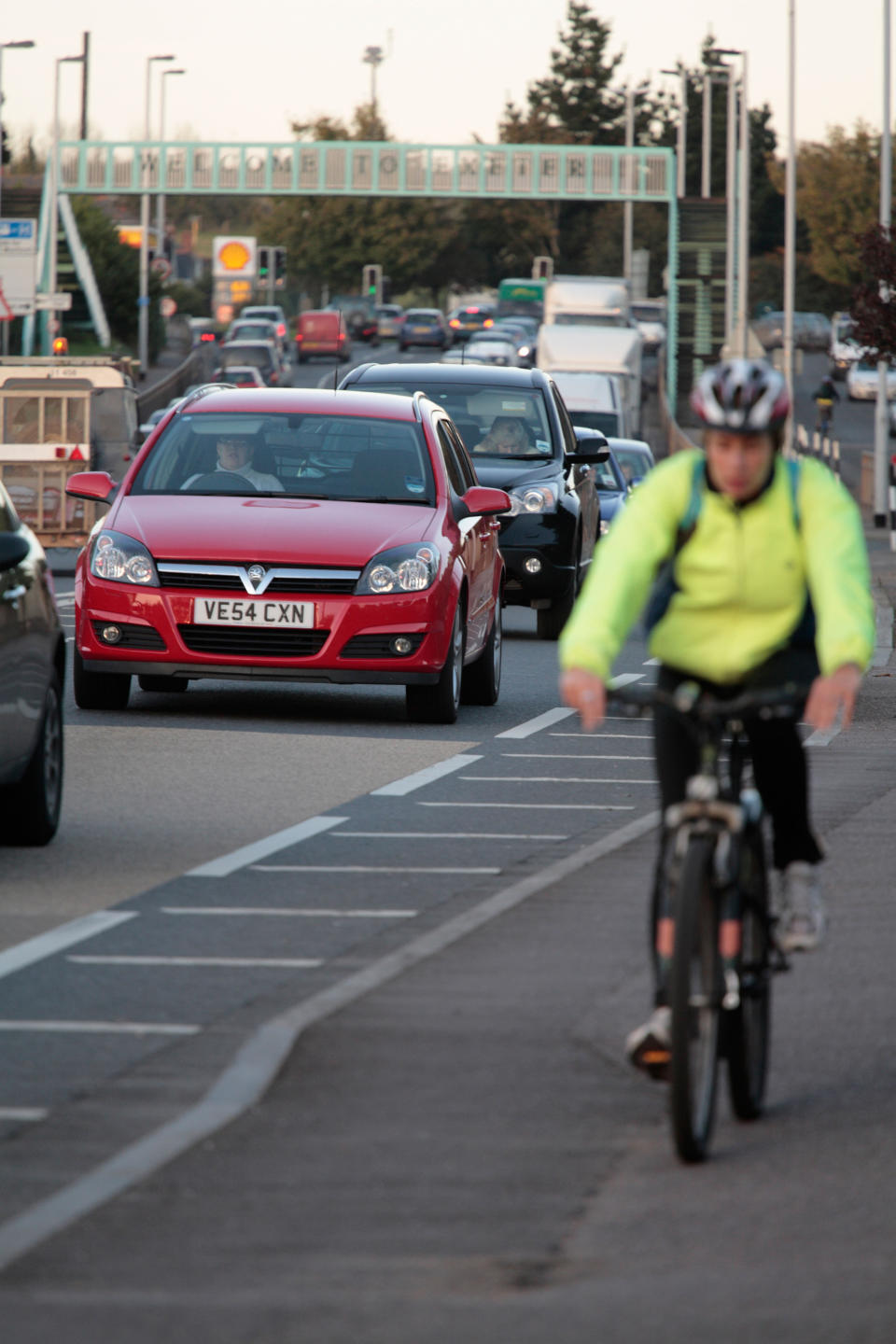 BRPYKG cyclist in queue of commuters Exeter Devon UK