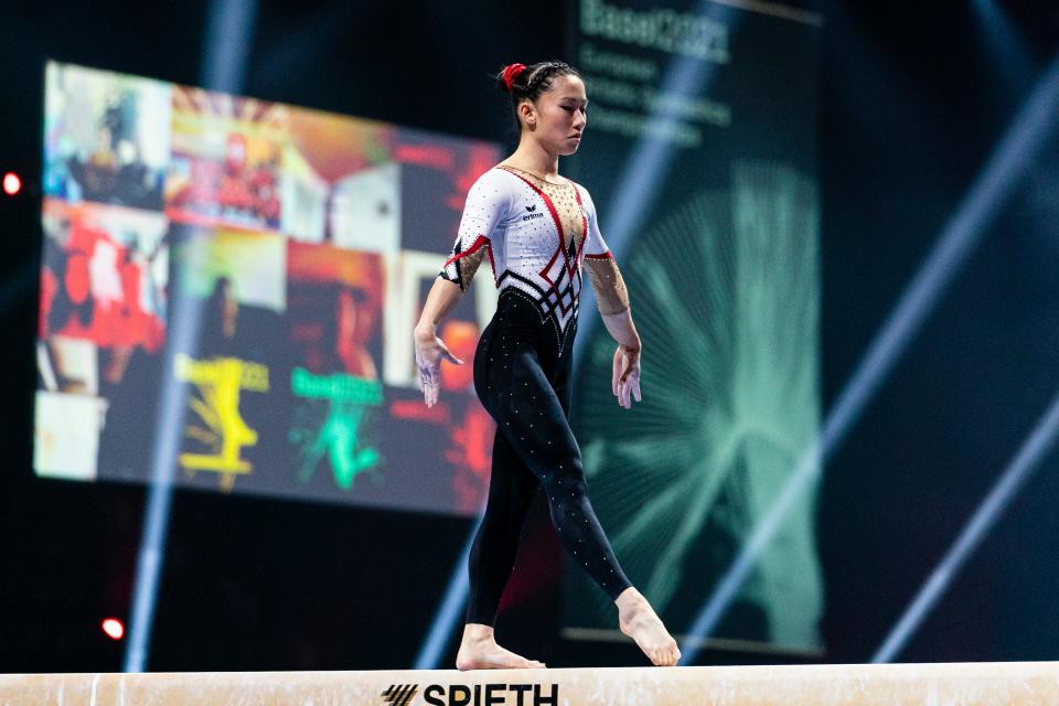 Kim Bui, a German gymnasts, competes on the beam in competition in Switzerland April 2021.