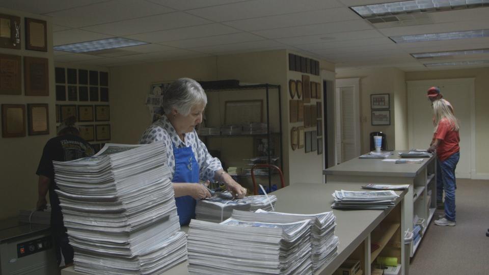Sorting day at the Canadian Record. The small staff of journalists did everything to get the newspaper out.