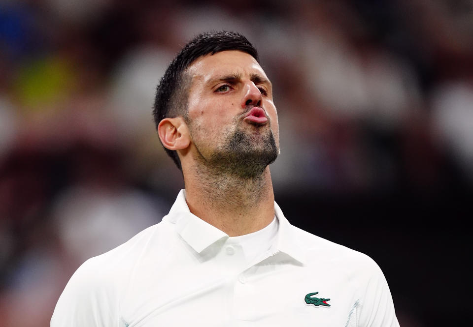 Novak Djokovic reacts to the Centre Court crowd after winning the second set against Holger Run on Monday. (Mike Egerton/PA Images via Getty Images)