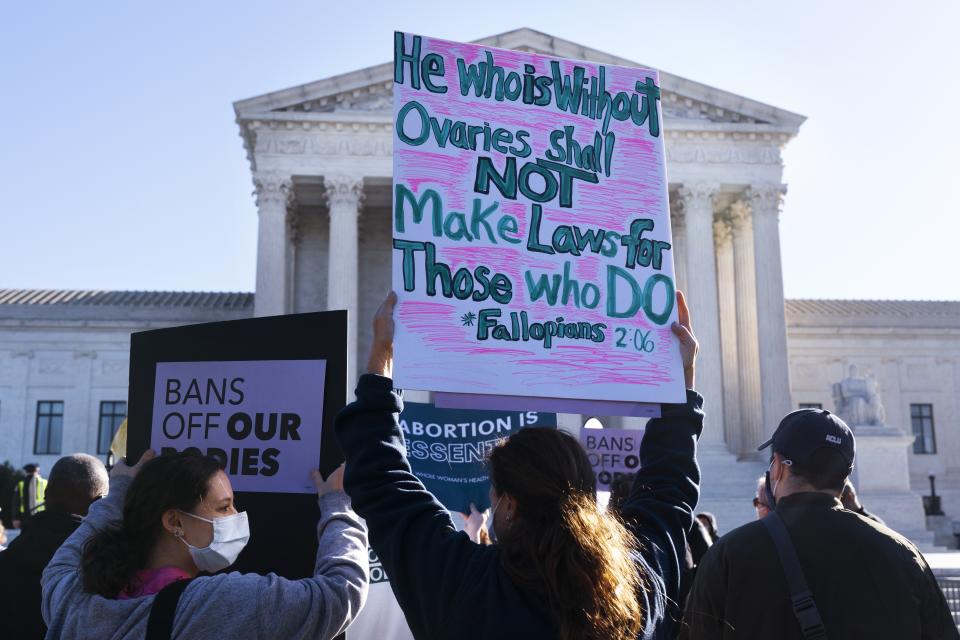 Ava Stevenson, 20, left, of Montgomery County, Md., rallies for abortion rights with her mother Jenni Coopersmith, center, outside the Supreme Court, Monday, Nov. 1, 2021, as arguments are set to begin about abortion by the court, on Capitol Hill in Washington. (AP Photo/Jacquelyn Martin)