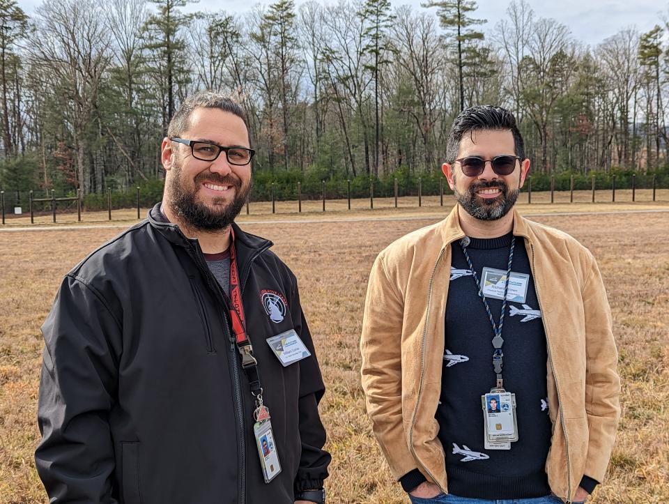 Air Traffic Controllers Richard Brown, right, and William Curcie, left, stand in front of the future location of the new $55 million Asheville Regional Airport Air Traffic Control Tower. They are also the NATCA facility president and vice president for the airport, respectively.