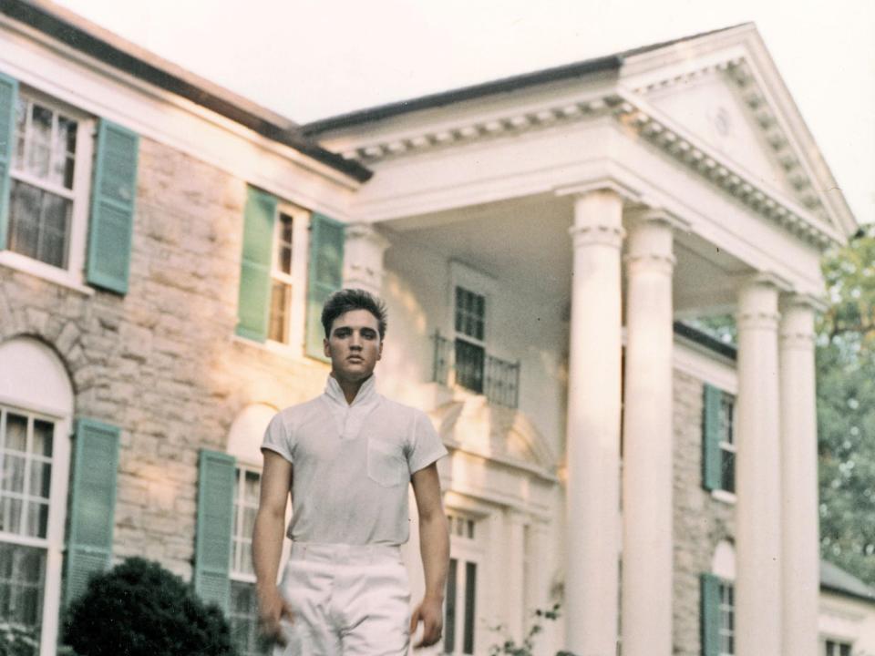 Rock and roll singer Elvis Presley strolls the grounds of his Graceland estate in circa 1957