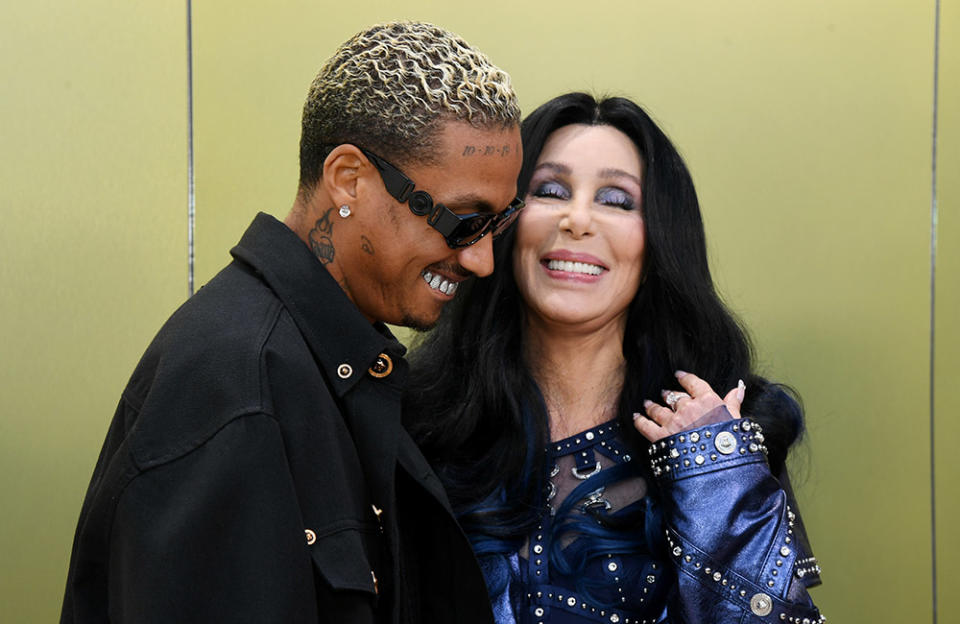 (L-R) Alexander Edwards and Cher attend the Versace FW23 Show at Pacific Design Center on March 09, 2023 in West Hollywood, California.