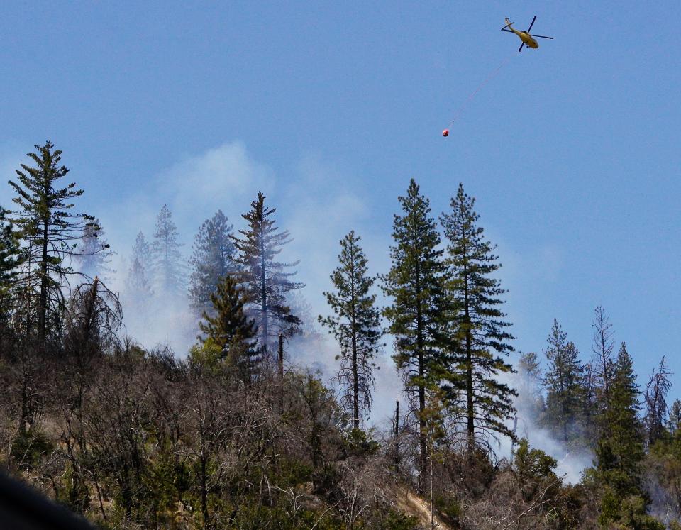 The Kennedy Fire, which broke out about noon Thursday after a head-on collision on Highway 299, ignited nearby grass and burned about 35 acres near Whiskeytown Lake.