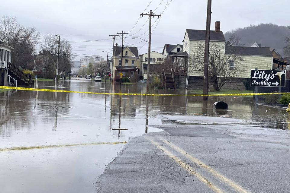 South York Street on Wheeling Island is closed to traffic as the Ohio River floods its banks, Thursday, April 4, 2024, in Wheeling, W.Va., following days of heavy rains in the region. (John McCabe/The Intelligencer via AP)