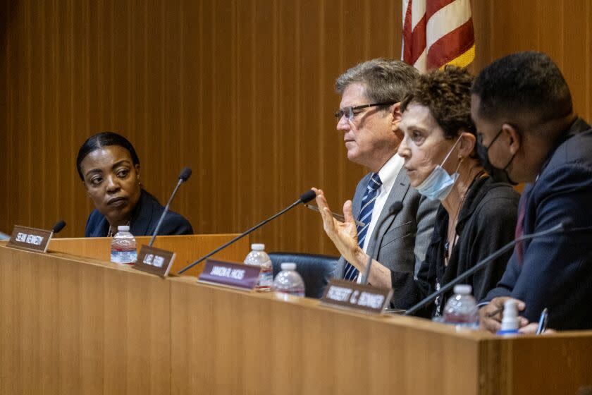 Los Angeles, CA - July 25: LASD Chief April Tardy, left, of Central Patrol Division, listens as commission member Lael Rubin, second from right, questions at the part 4 of public hearing in the Civilian Oversight Commission's investigation on deputy gangs at the Loyola Marymount University, Albert H. Girardi Advocacy Center on Monday, July 25, 2022 in Los Angeles, CA. (Ringo Chiu / For The Times)