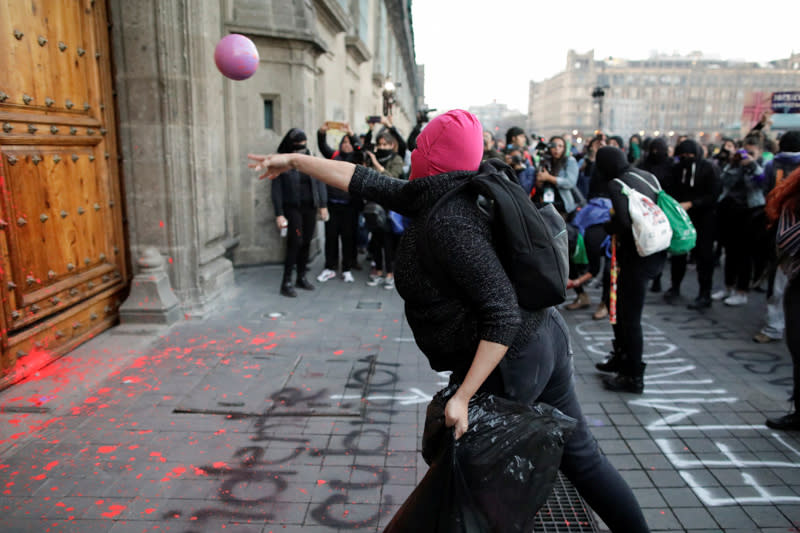 People take part in a protest against gender-based violence in downtown of Mexico City