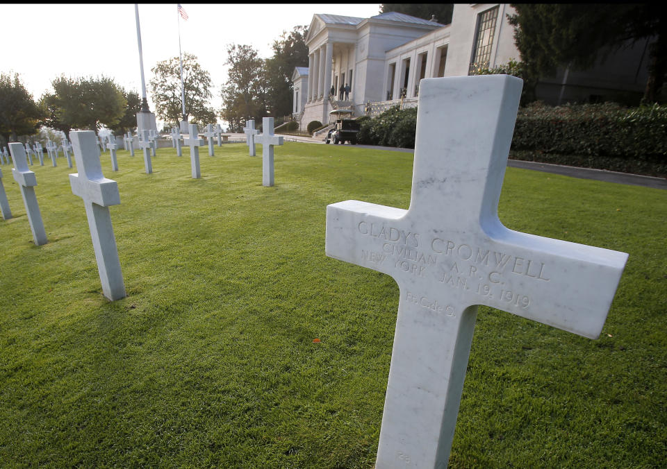 FILE - This file photo taken on Friday, Nov. 2, 2018 shows the graves of US nurses Dorothy Cromwell, left, and Gladys Cromwell, right, at the American Cemetery in Suresnes, near Paris, France. The two were beloved American nurses who worked tirelessness for Red Cross in France, but committed suicide shortly after the war overs the horrors they saw. (AP Photo/Michel Euler, File)