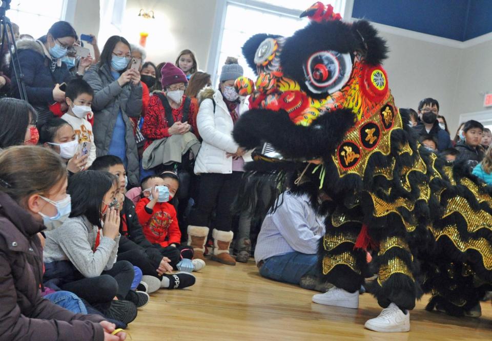 The lion dance, performed by the Boston Chinese Freemasons Athletic Club, gets up close and personal to the audience during the Lunar New Year Festival in Braintree, Sunday, Jan. 15, 2023.