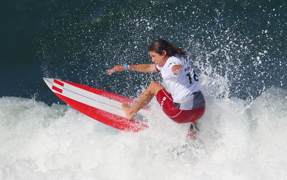 Peru's Sofia Mulanovich catches a wave - REUTERS