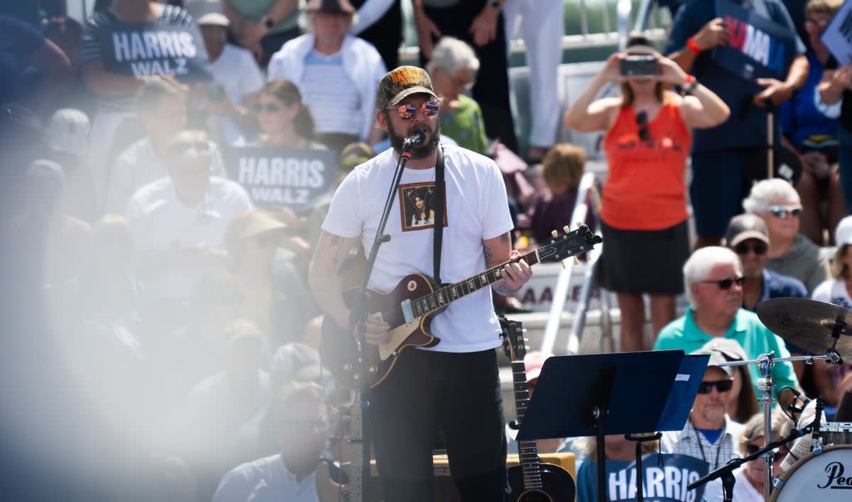 Bon Iver wears Harris-Walz camo hat on stage at rally in Wisconsin (Getty Images)