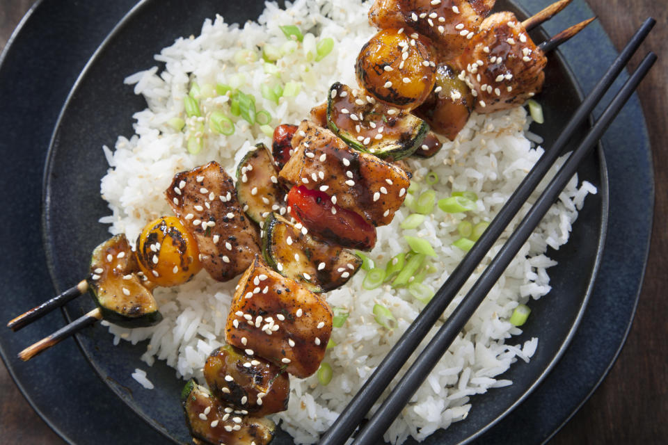 Salmon teriyaki skewers over rice