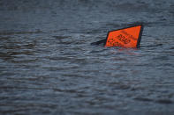 <p>A ‘road closed’ sign is seen submerged in floodwater during Storm Ophelia in Galway, Ireland, Oct.16, 2017. (Photo: Clodagh Kilcoyne/Reuters) </p>