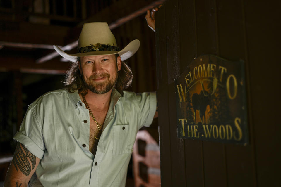 Brian Kelley poses for a portrait outside his cabin Wednesday, April 17, 2024, in Nashville, Tenn. (AP Photo/George Walker IV)